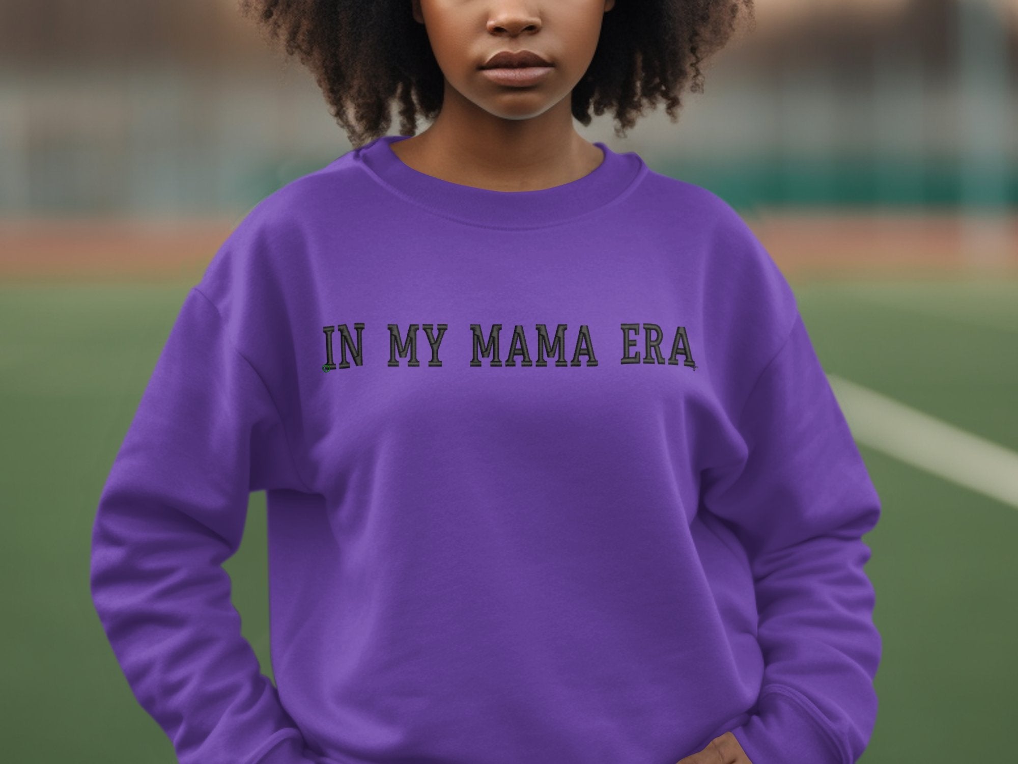purple sweater with "In My Mama Era" embroidered on it