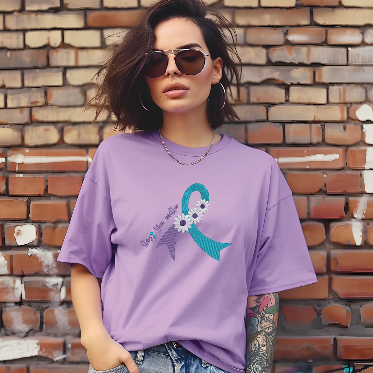 purple t shirt with "Stay; You matter" embroidered on it